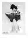 Fig. 23 - Combined toy doll and artificial flower