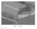 Fig. 15 - Miter gauge lock for sliding table saws