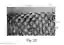 Fig. 14 - Apparatus having forming members with surface texture for making nonwoven material having discrete three-dimensional deformations with wide base openings