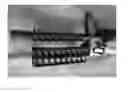 Fig. 06 - Quick detach accessory mount for a rifle