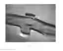 Fig. 10 - Ambidextrous bolt action rifle chassis and plug