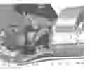 Fig. 08 - Handheld controller with spring-biased third finger button assembly
