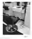 Fig. 02 - Electrically integrated salon styling chair with ergonomic equipment caddy