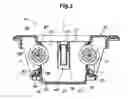Fig. 04 - Container holder including a swing member rotatably supporting a roller to hold a container received therein